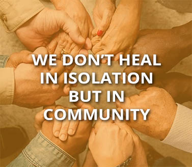 Diverse hands together in a circle with overlay quote, "We don't heal in isolation but in community."
